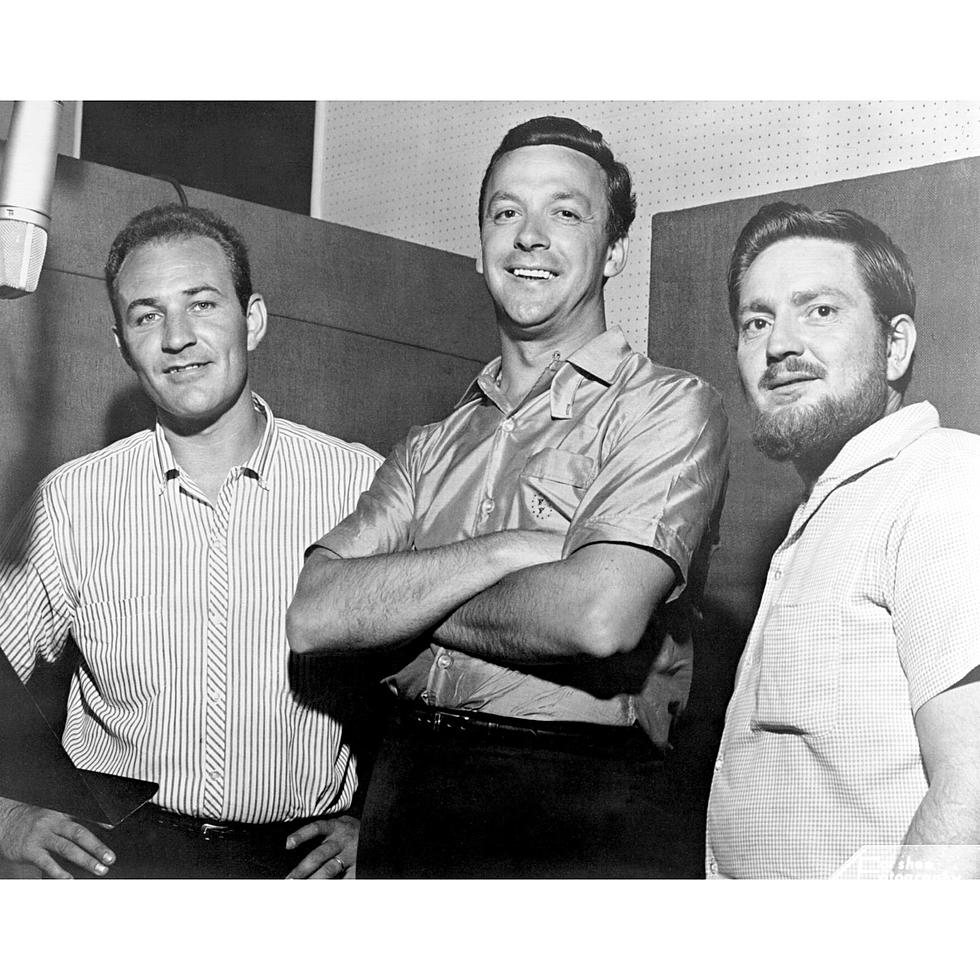 Fred Foster, president of Monument Records, poses with his newest signees, Fred Carter (left) and Willie Nelson (right)